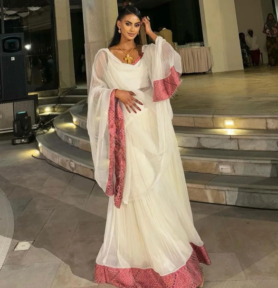 Elegant Light Pink Habesha Kemis Handwoven Habesha Dress with Exquisite Embroidery