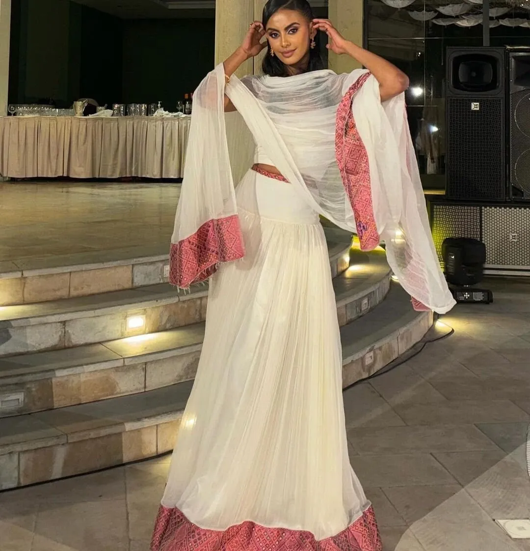 Elegant Light Pink Habesha Kemis Handwoven Habesha Dress with Exquisite Embroidery