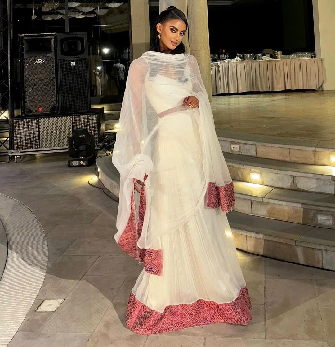 Elegant Light Pink Habesha Kemis Handwoven Habesha Dress with Exquisite Embroidery